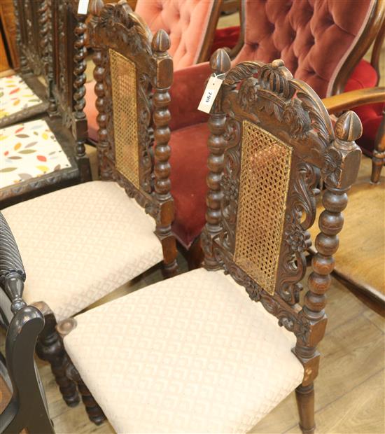 A pair of Victorian carved oak Carolean style chairs